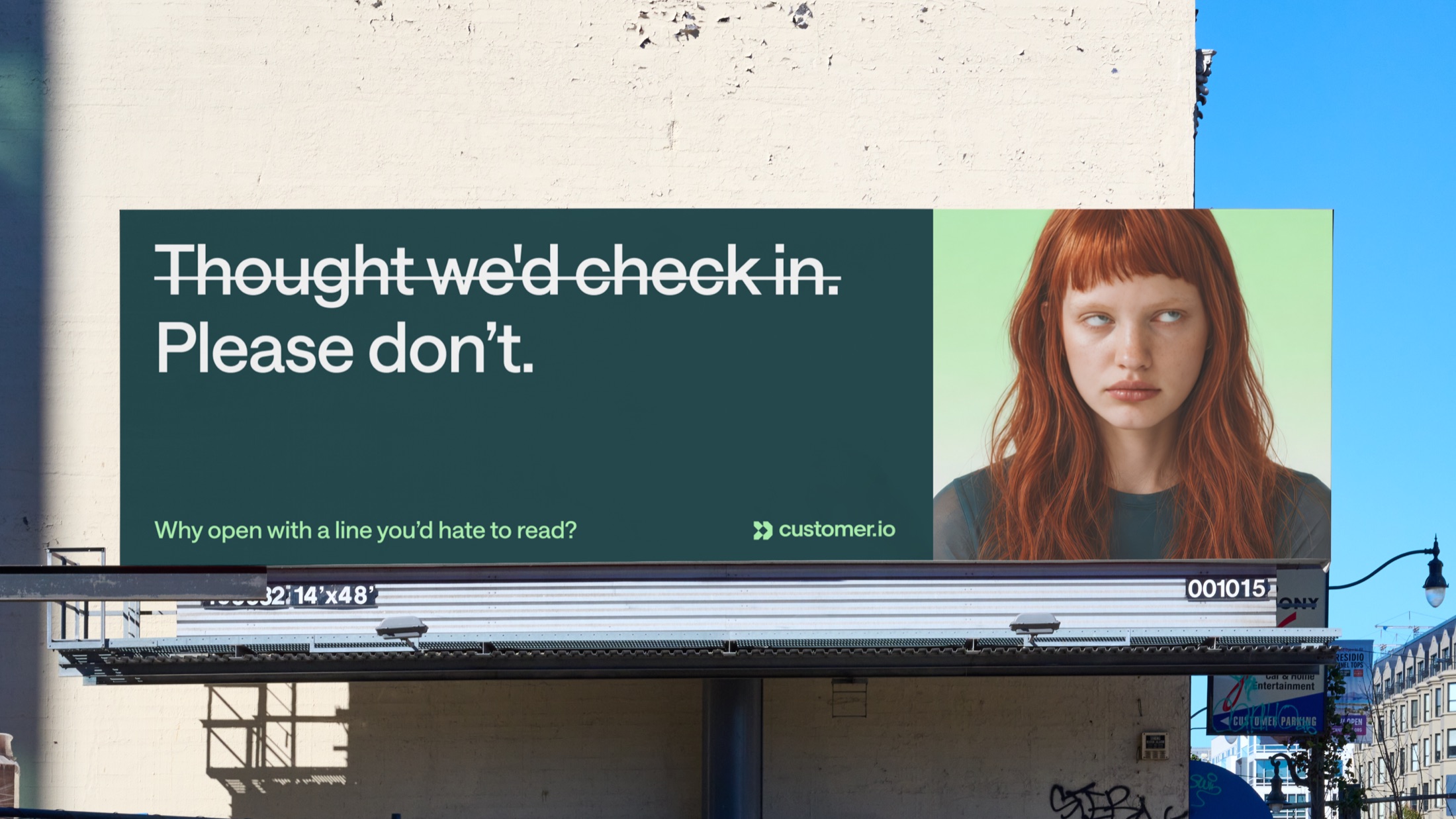 Billboard: “Thought we’d check in. Please don’t.” with the first line struck through